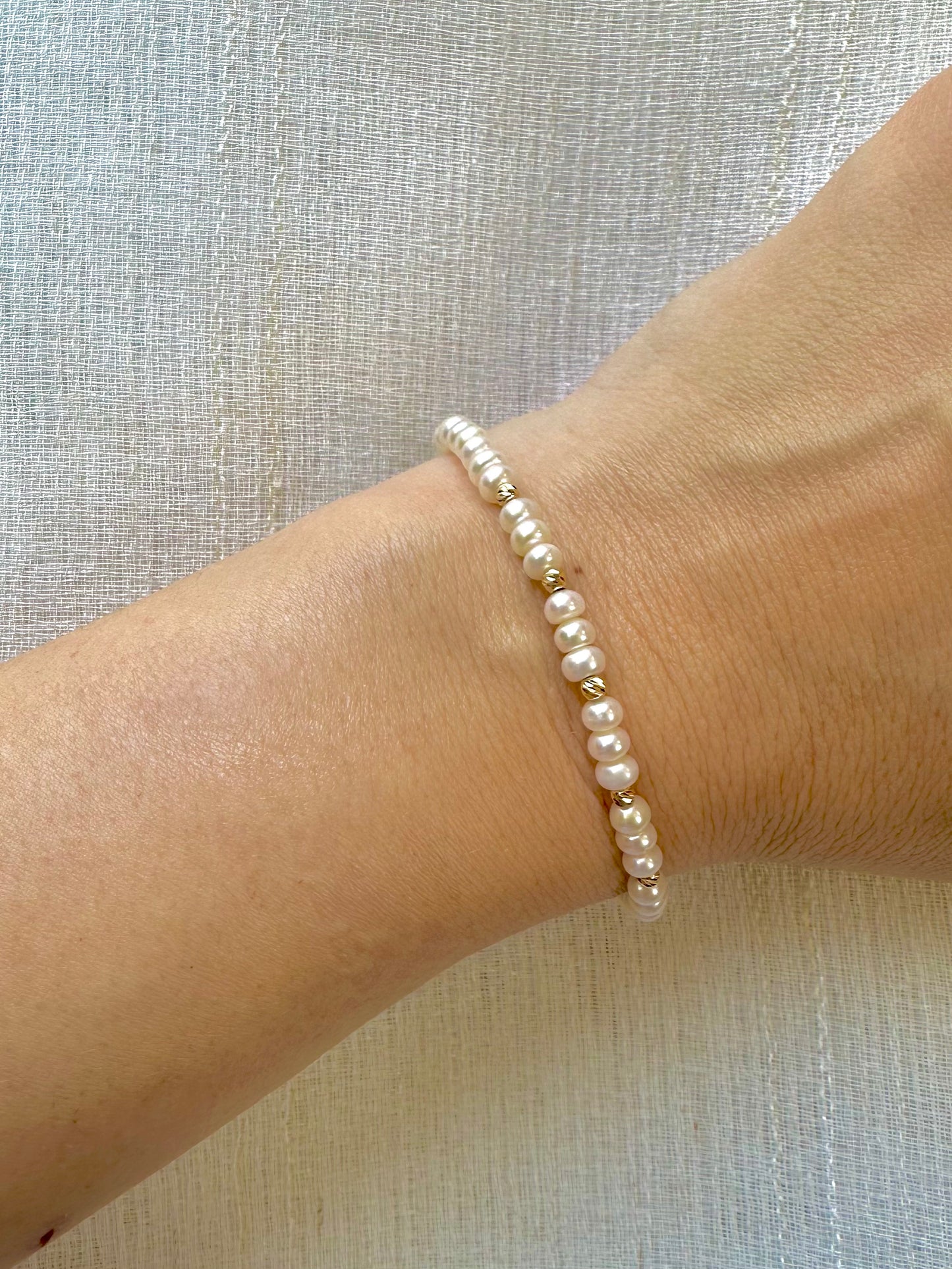 Freshwater Pearls Beaded bracelet featuring 18 karat faceted beads and findings.&nbsp; Available with a chain extender for a comfort wear. | Ella Creations Jewelry