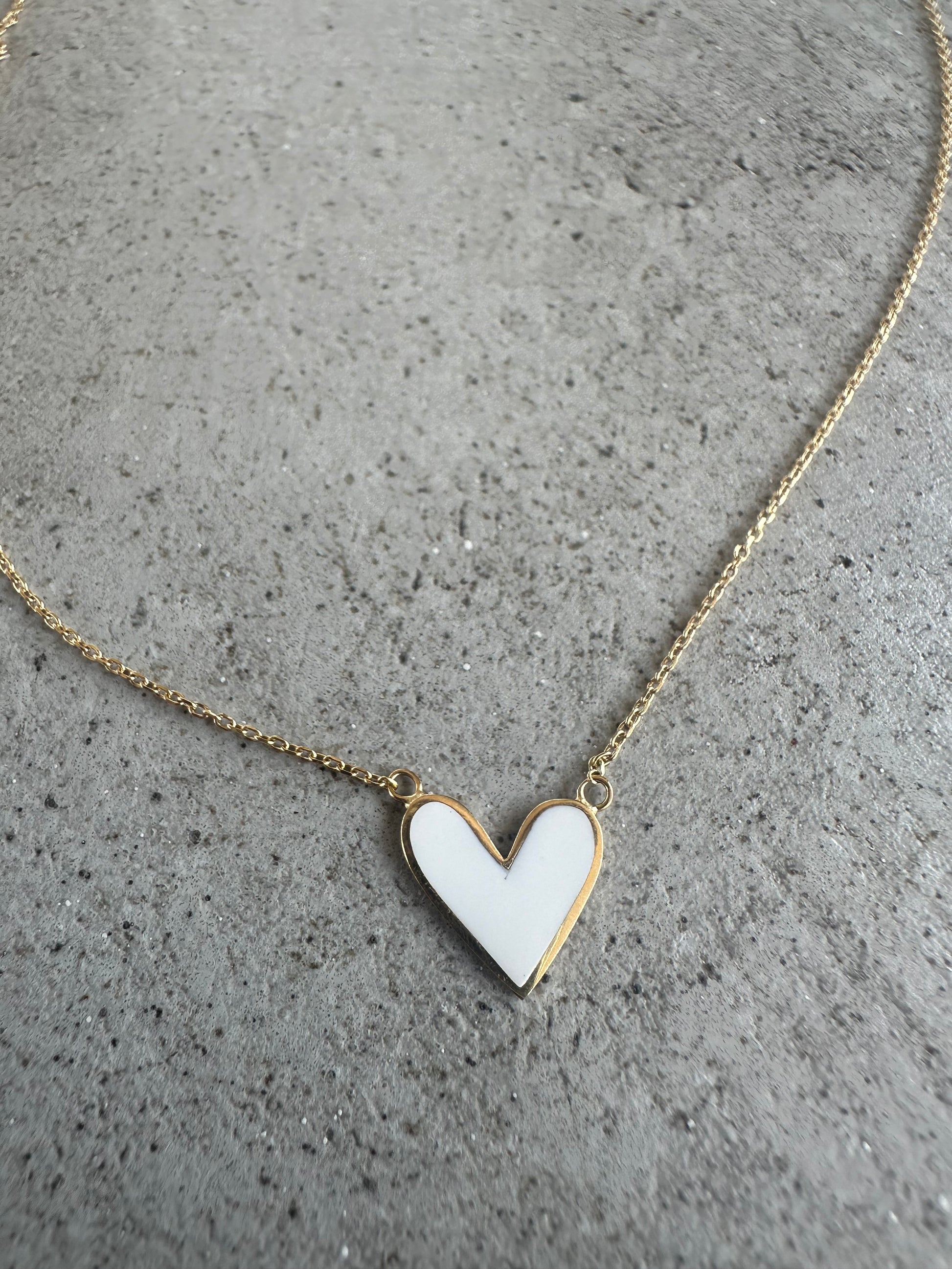 white Gold Heart Necklace handcrafted in 18k gold, offering a dual design: enamel at on one side and plain gold at the other side| Ella Creations jewelry