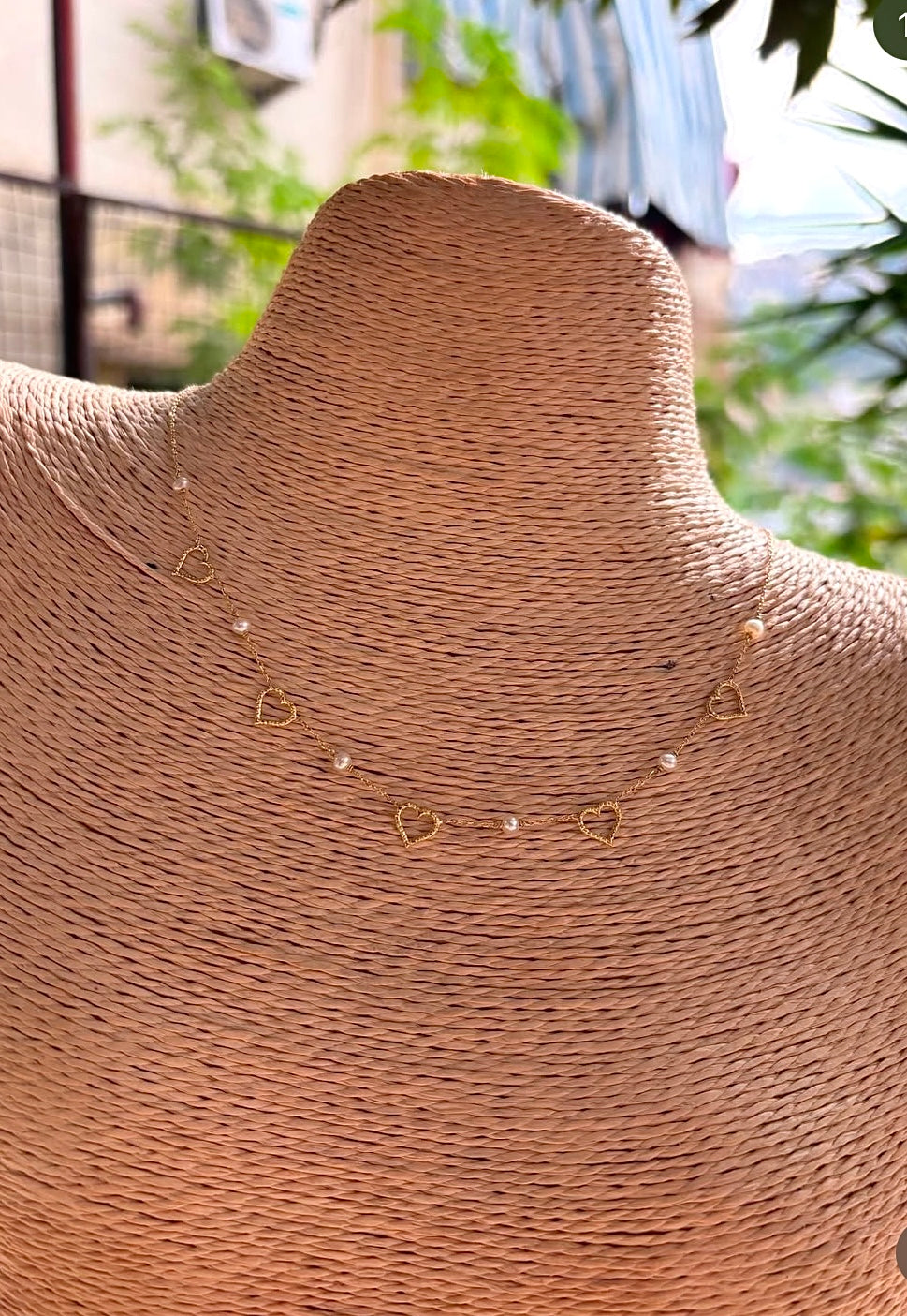 Dainty and light weight solid gold necklace featuring Fresh water Pearls and open-heart charms securely affixed at evenly spaced intervals. This necklace is handcrafted in 18 karat gold ensuring lifetime luster and resistance to tarnishing. | Ella Creations Jewelry