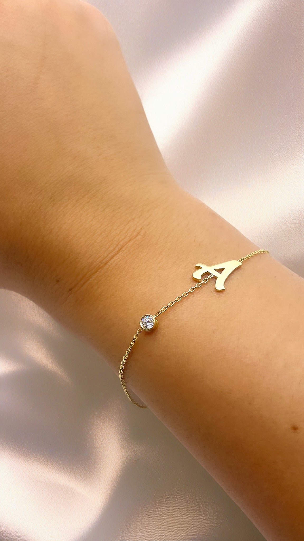 gold bracelet with initial and diamond