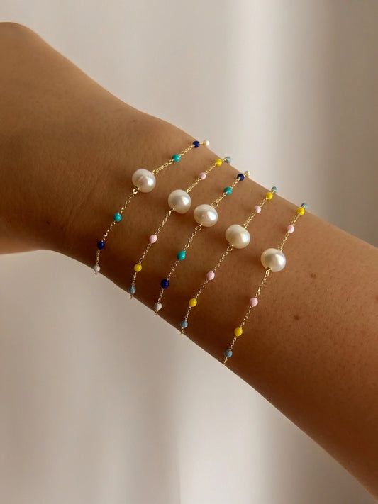 stunning Pearl Bracelet Delicately crafted in a 18 karat gold chain, and featuring a series of enamel beads in a delightful array of colors | Ella Creations Jewelry