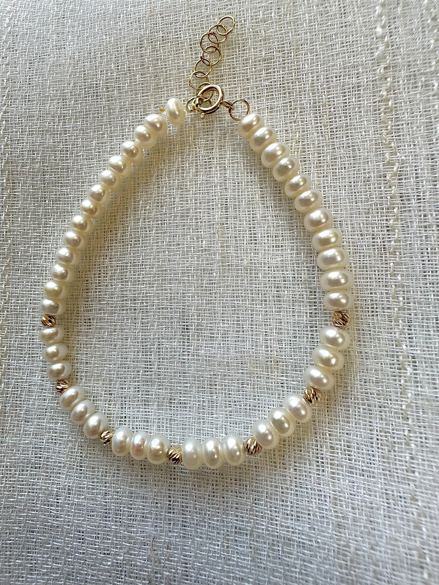 Freshwater Pearls Beaded bracelet featuring 18 karat faceted beads and findings.&nbsp; Available with a chain extender for a comfort wear. | Ella Creations Jewelry