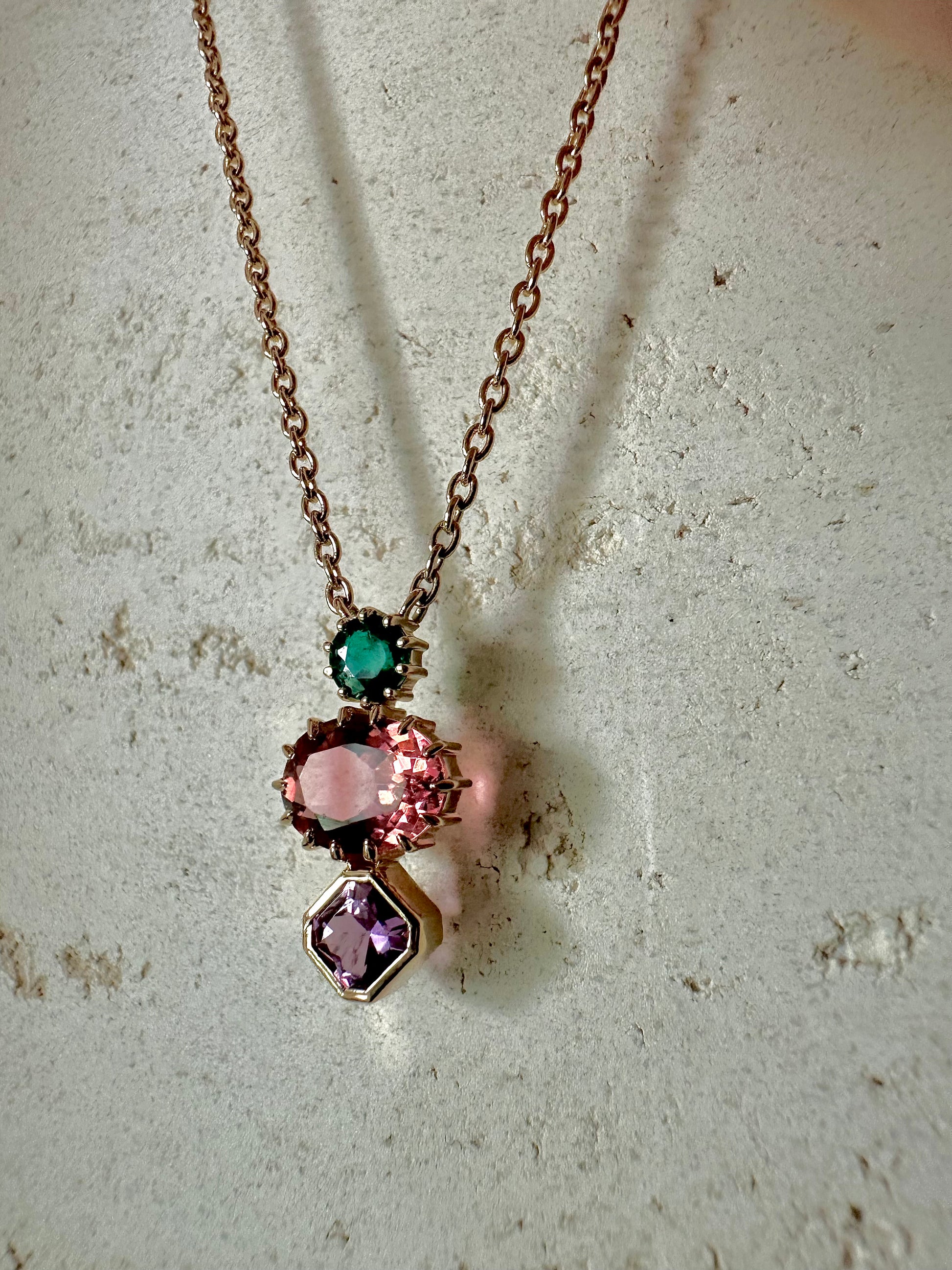 Three Stone necklace featuring tourmaline, emerald and sapphire each in a different stone cut handcrafted in 18k solid gold | Ella Creations Jewelry