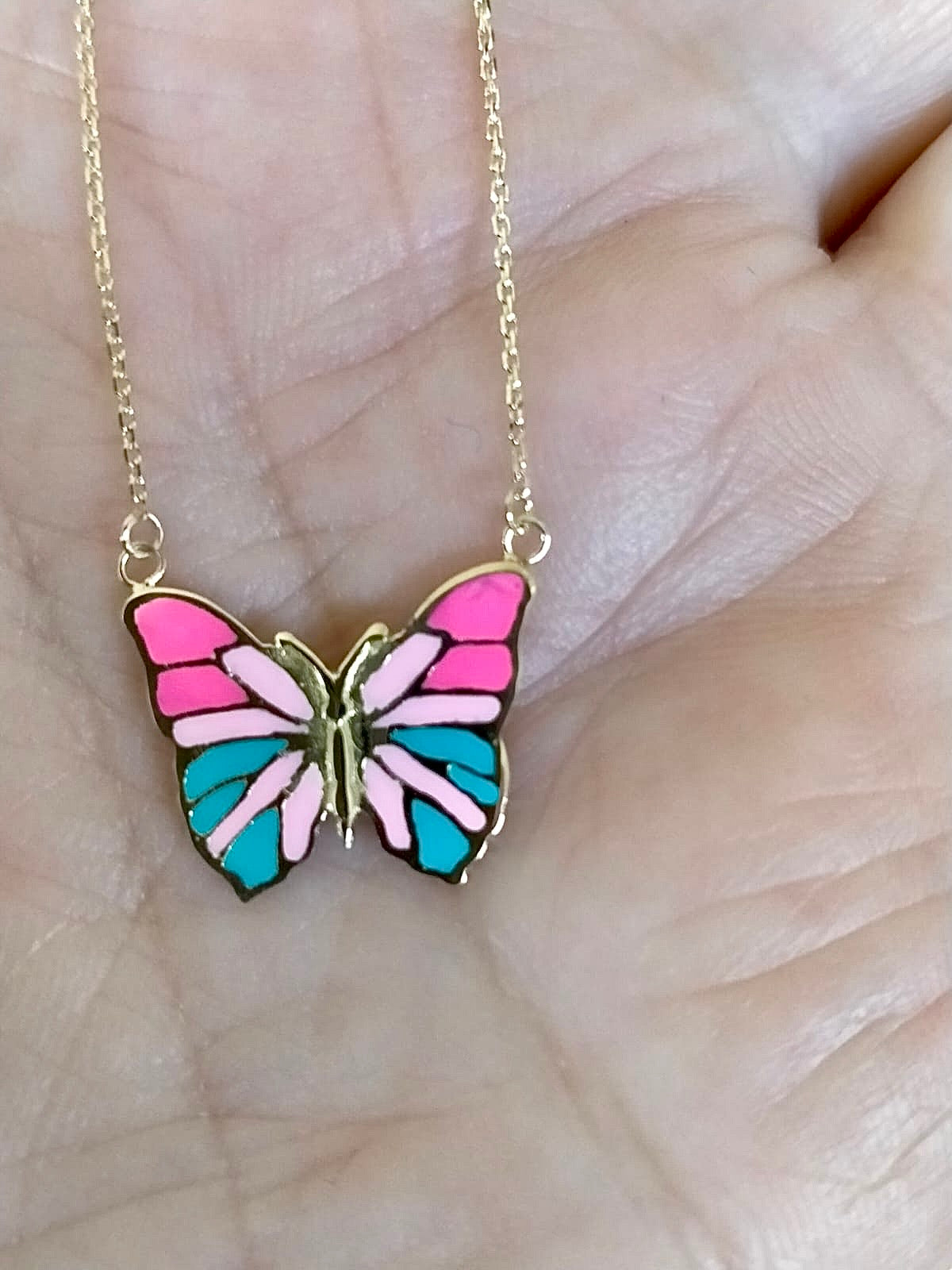 Gold butterfly necklace hand-enameled in pink shades and turquoise 