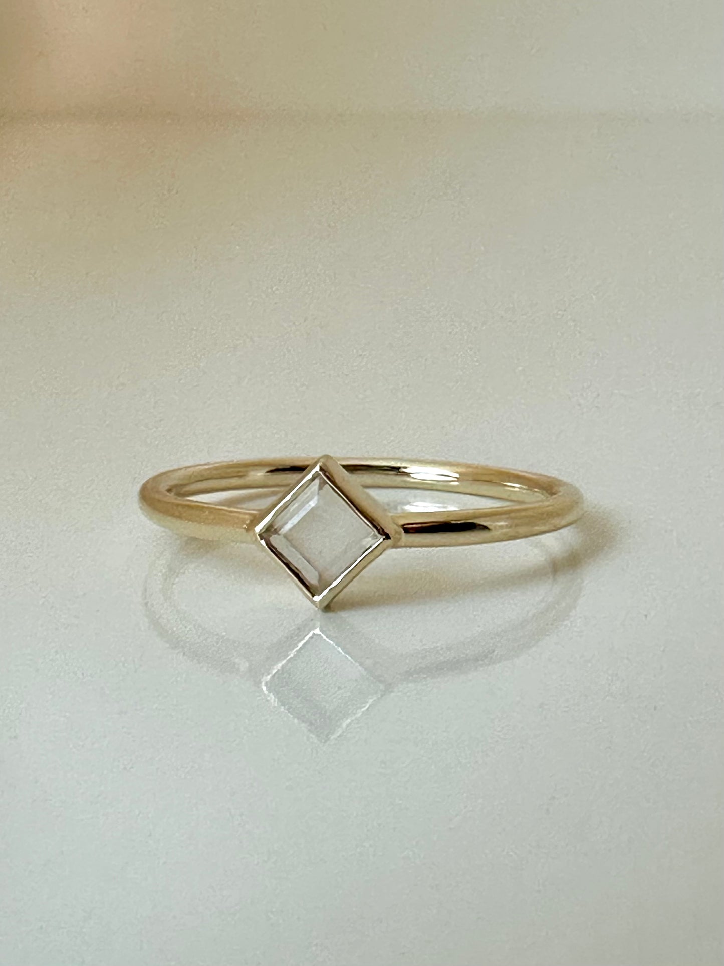 Elegant and dainty Rhombus rings,  Handcrafted in 18k solid yellow gold, each features a thin band ring with a unique Rhombus bezel setting that showcases clear quartz stone | Ella Creations Jewelry