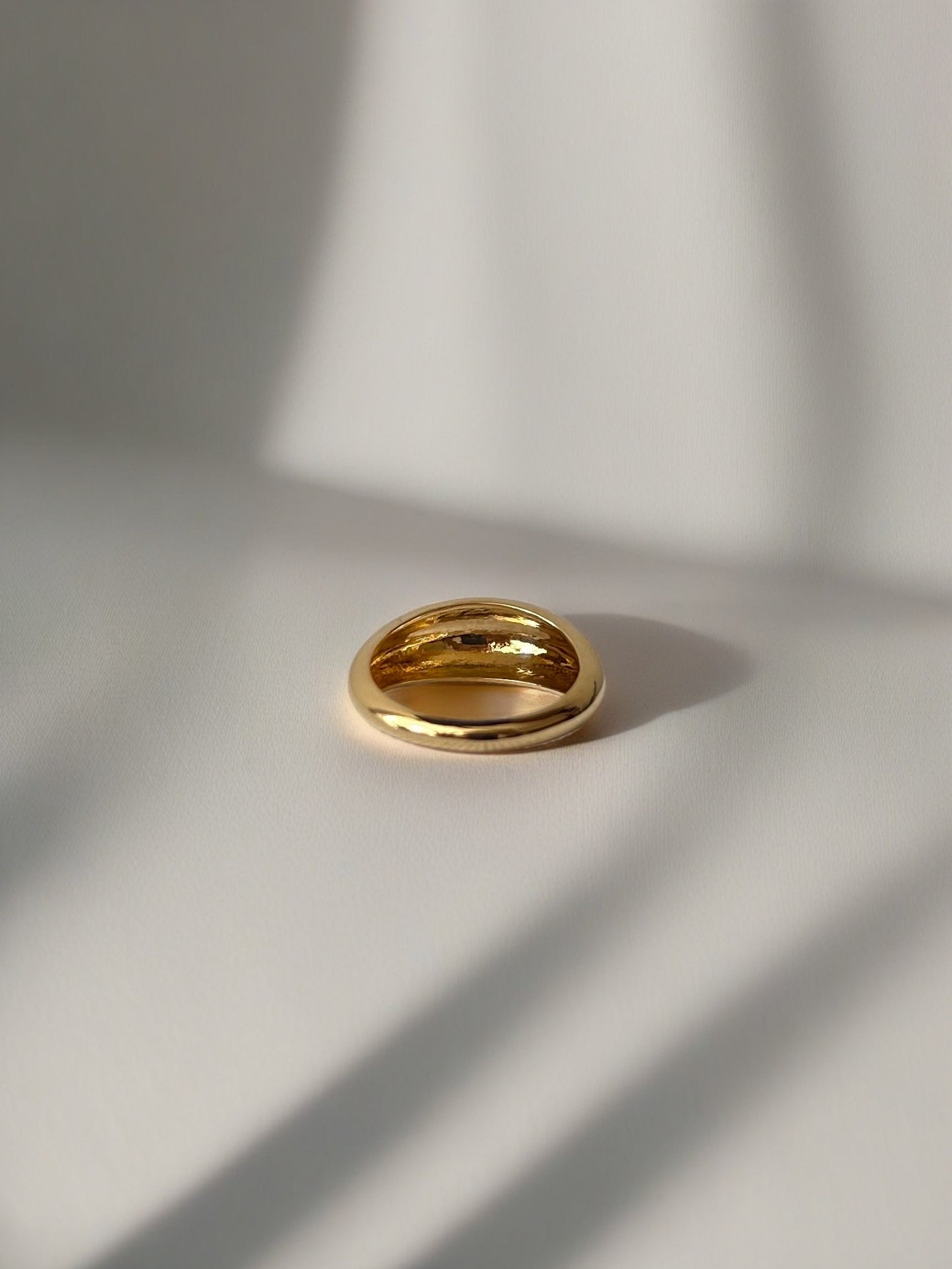 Gold Dome Ring handcrafted in 14k or 18k solid gold, the ring tampers from 7.5mm to 3mm | Ella Creations Jewelry 