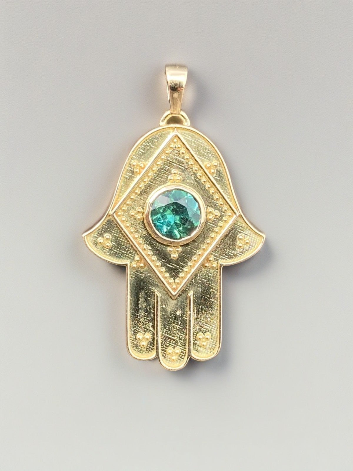 18k Hamsa gold pendant with a center green tourmaline | Ella Creations Jewelry