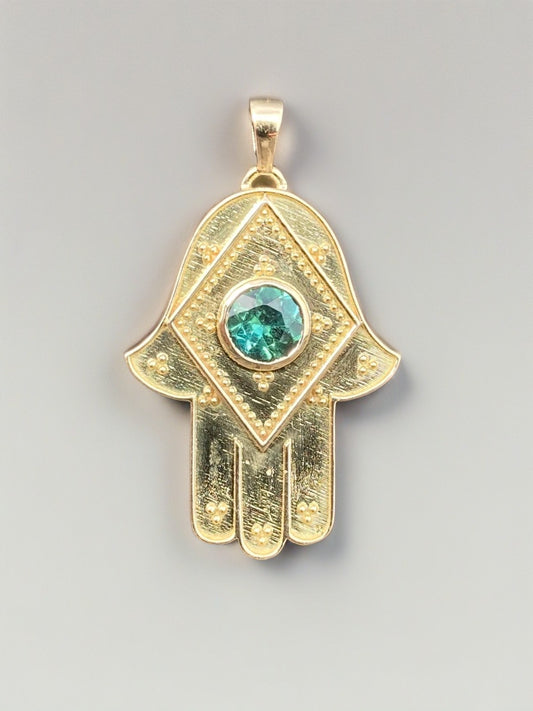 18k Hamsa gold pendant with a center green tourmaline | Ella Creations Jewelry