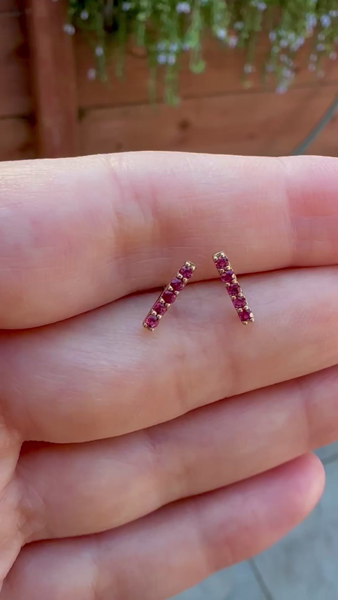 Beautiful and sleek Bar stud earrings adorned with 1.7mm round natural Ruby gemstones. Handcrafted in 18 karat Gold, these Ruby Stud Earrings have a linear design that makes them comfortable for everyday wear. Sold as pair.